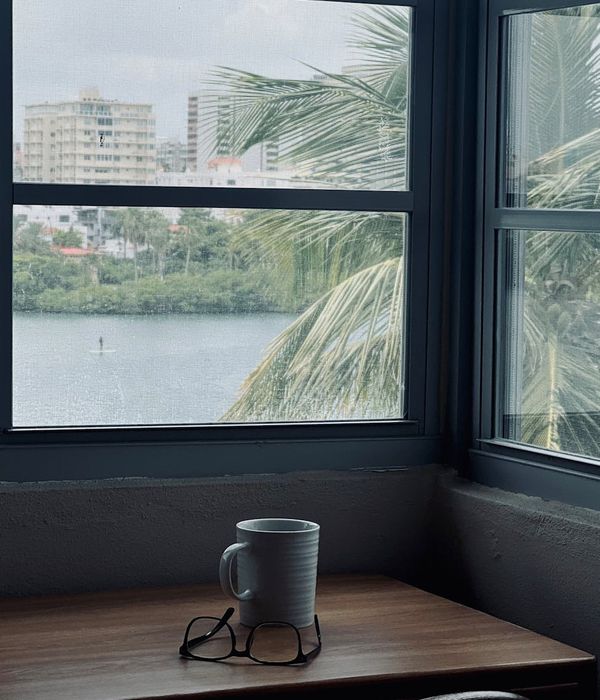 A modern, clean office space with natural light, suitable for relaxation practices.